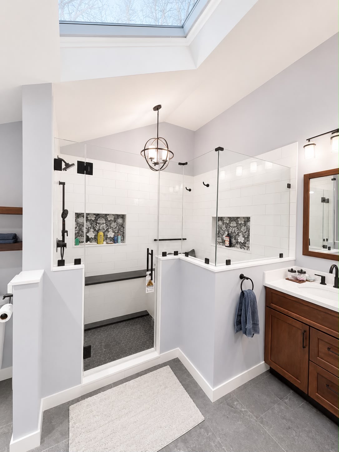 Skylight shower enclosure by Horus Glassworks — Black hardware & clear glass